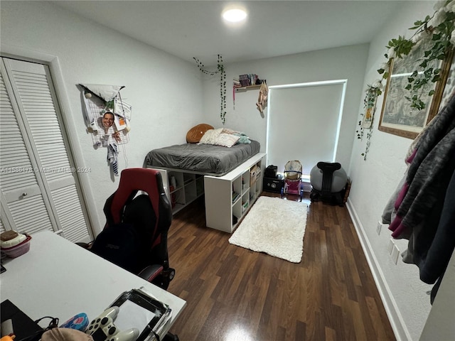 bedroom featuring a closet and dark hardwood / wood-style floors