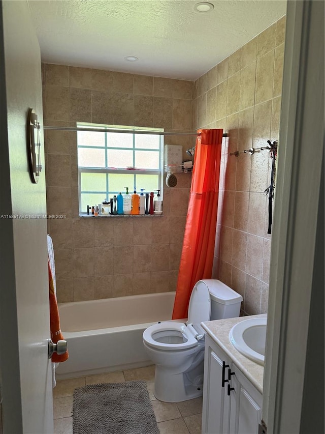 full bathroom featuring tile flooring, tile walls, shower / bath combo with shower curtain, toilet, and vanity