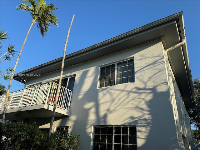 back of house with a balcony