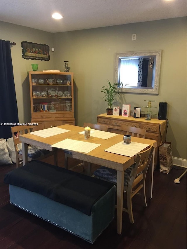 dining area with dark wood-type flooring