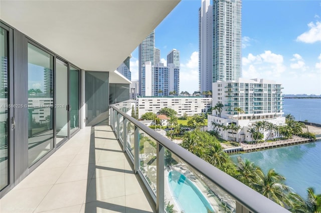 balcony featuring a water view