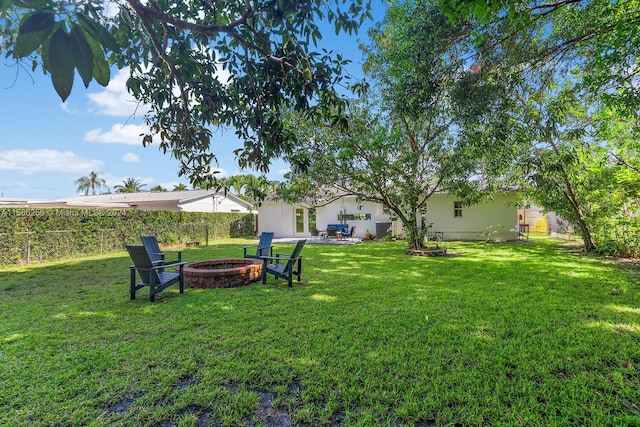 view of yard with an outdoor fire pit