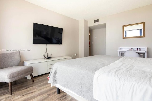 bedroom with light wood-type flooring