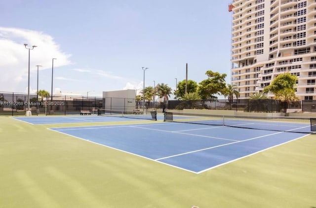 view of sport court with basketball hoop