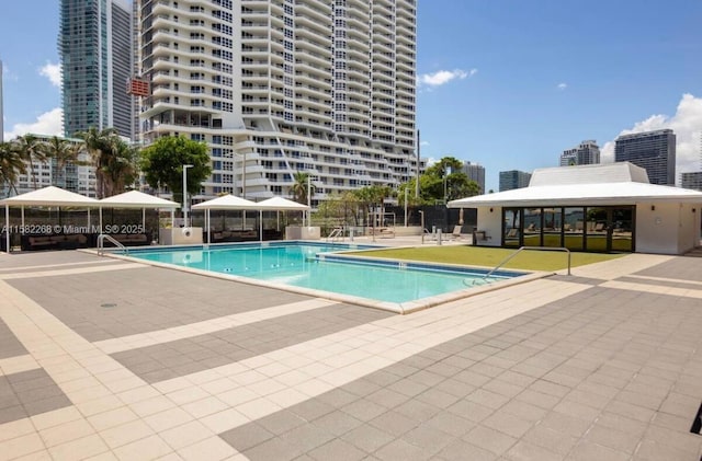 view of swimming pool featuring a gazebo and a patio area