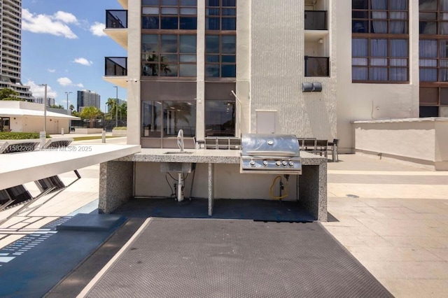 view of patio / terrace with sink, grilling area, and exterior kitchen