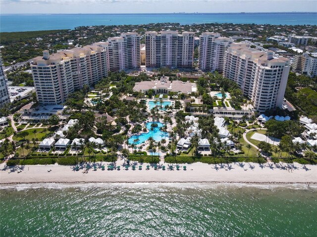 bird's eye view with a water view and a view of the beach