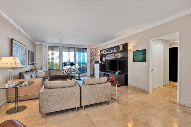 living room with light tile patterned flooring and crown molding