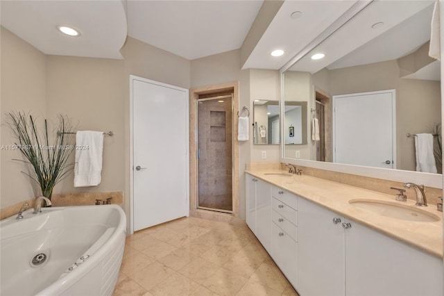 bathroom with tile patterned flooring, dual vanity, and plus walk in shower