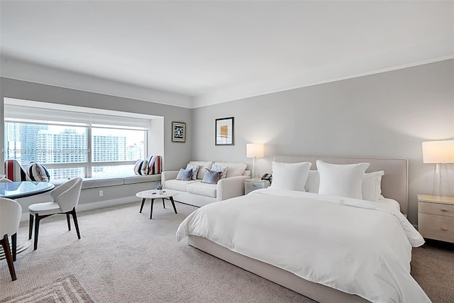 bedroom featuring ornamental molding and carpet floors