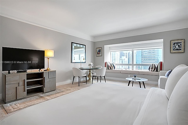 bedroom featuring crown molding and carpet flooring