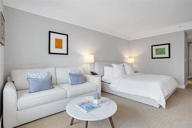 bedroom featuring crown molding and carpet flooring