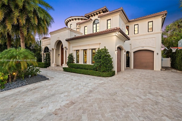 mediterranean / spanish-style house featuring a garage