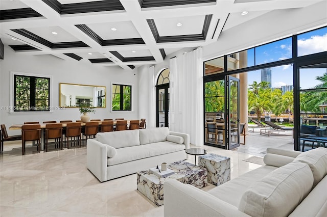 living room featuring a wealth of natural light, coffered ceiling, and light tile flooring