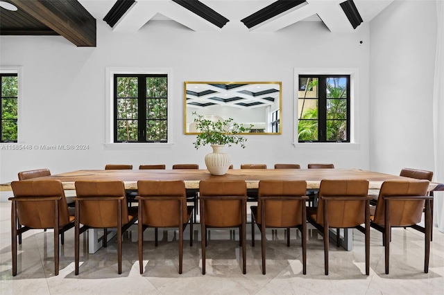 dining area featuring plenty of natural light, beamed ceiling, and light tile floors