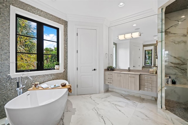 bathroom featuring crown molding, tile walls, tile floors, a washtub, and vanity