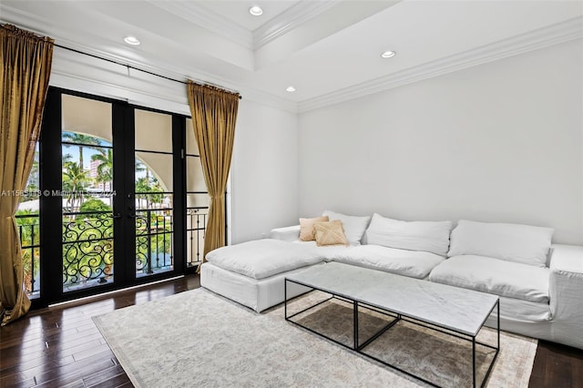 living room featuring a tray ceiling, french doors, crown molding, and dark wood-type flooring