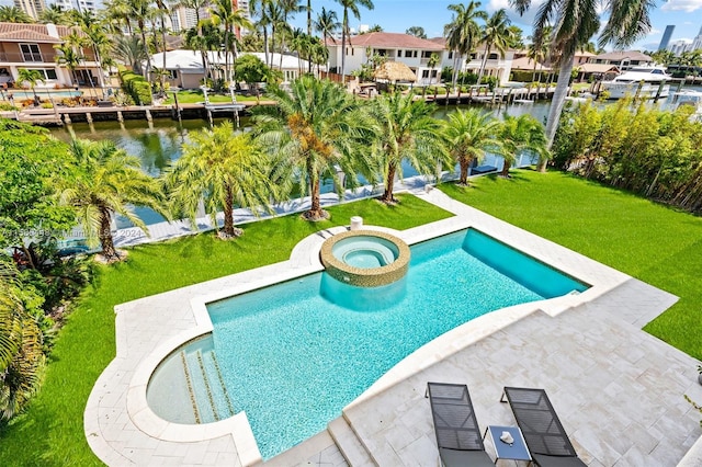 view of swimming pool featuring an in ground hot tub and a lawn