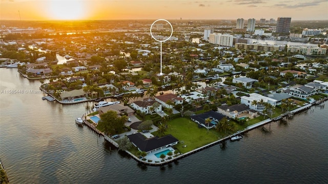 aerial view at dusk with a water view