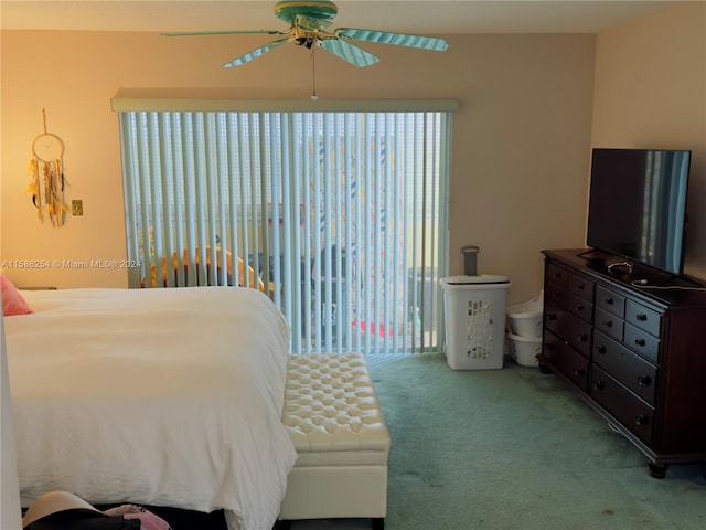 carpeted bedroom featuring ceiling fan and access to outside