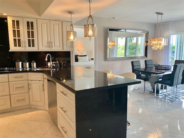 kitchen featuring sink, light tile flooring, a wealth of natural light, and pendant lighting