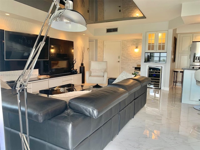 tiled living room featuring wine cooler and a high ceiling