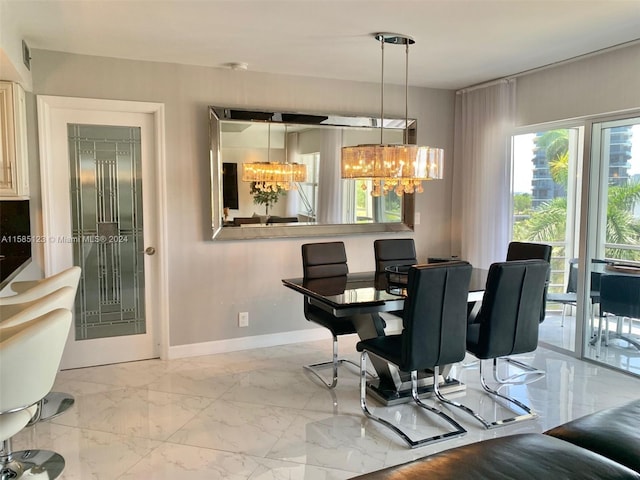 tiled dining room with an inviting chandelier