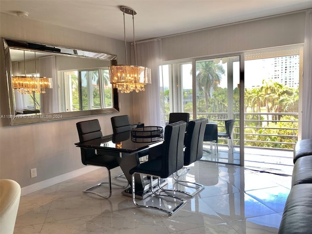 tiled dining room featuring an inviting chandelier and plenty of natural light