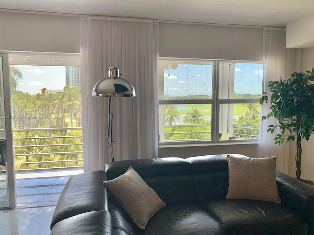 tiled living room featuring a healthy amount of sunlight