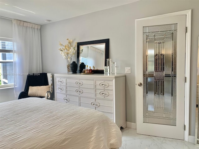 tiled bedroom featuring a closet