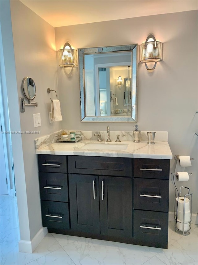 bathroom with tile flooring and vanity