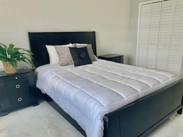 tiled bedroom featuring a closet