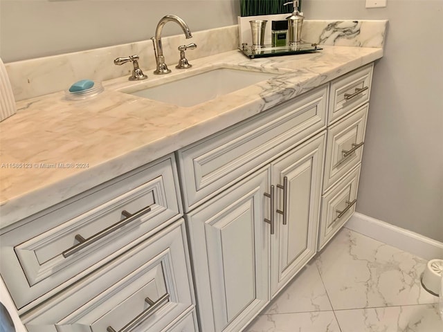 bathroom featuring tile flooring and vanity