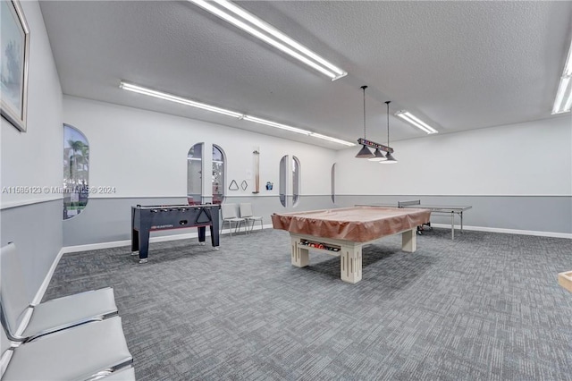 recreation room with billiards, a textured ceiling, and dark carpet