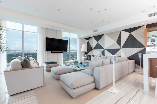 living room with a wealth of natural light and expansive windows