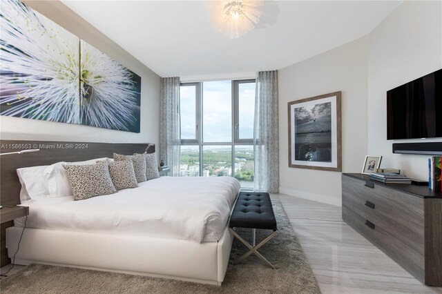 bedroom featuring expansive windows