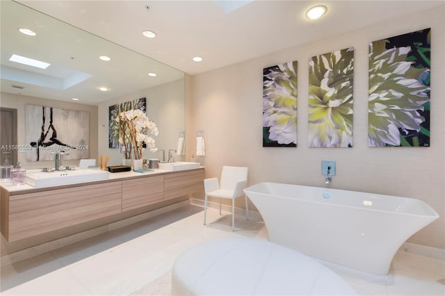 bathroom with tile floors, a washtub, double vanity, and a skylight