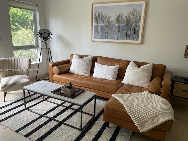 tiled living room with plenty of natural light