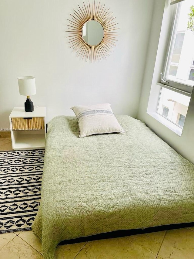 bedroom with tile floors