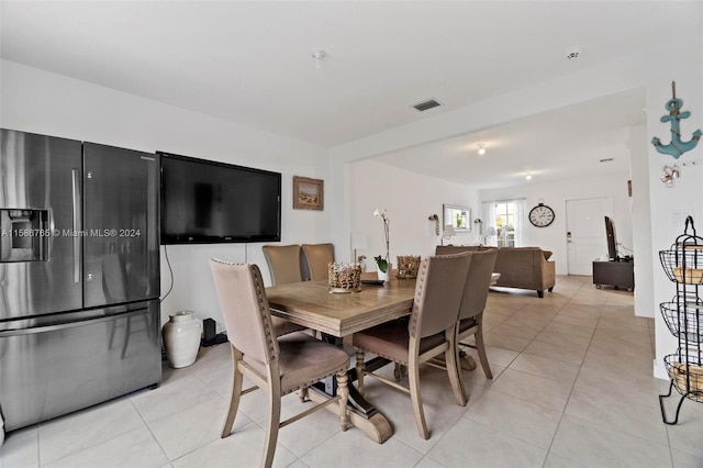 dining room featuring light tile patterned floors