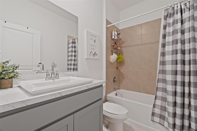 full bathroom with vanity, shower / tub combo with curtain, and toilet