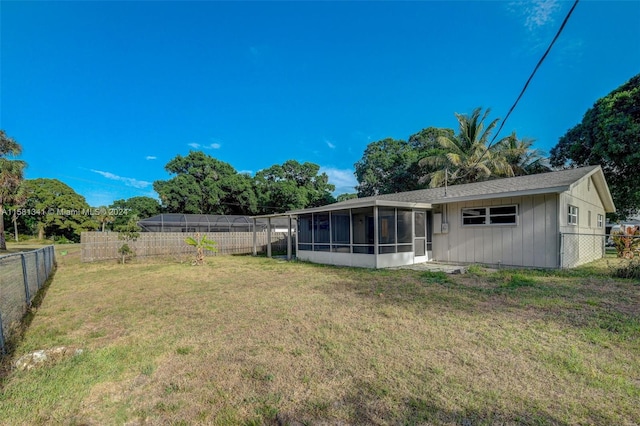 view of yard with a sunroom