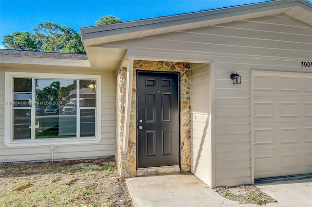 entrance to property featuring a garage