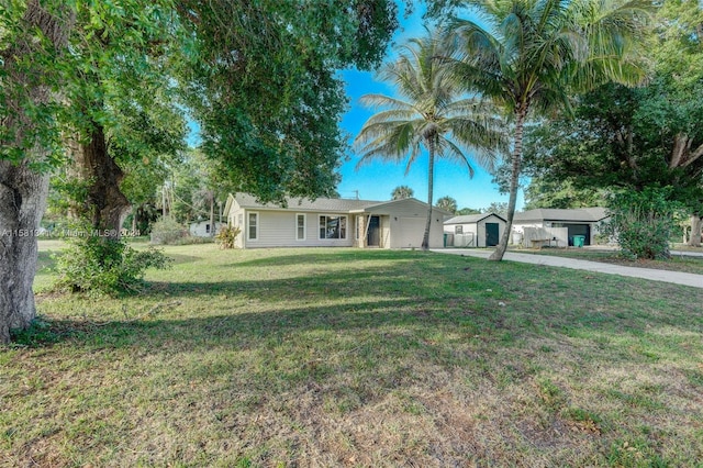 single story home featuring a front yard