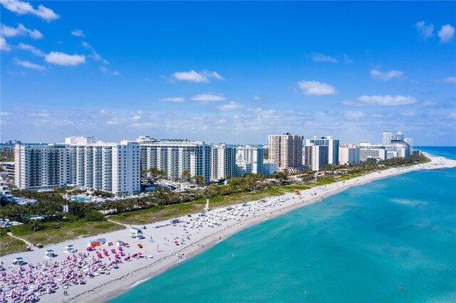 birds eye view of property with a view of the beach and a water view