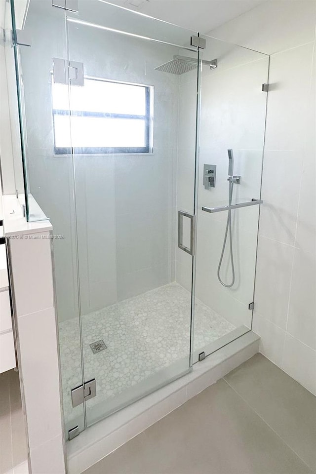 bathroom featuring tile patterned flooring and walk in shower