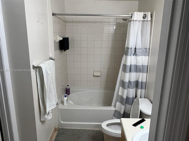 bathroom with shower / bath combo and toilet