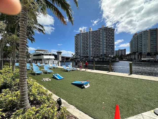 view of community featuring a yard and a water view