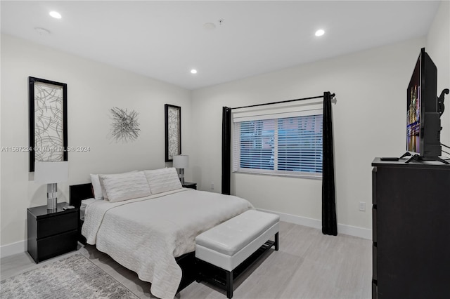 bedroom with light hardwood / wood-style floors