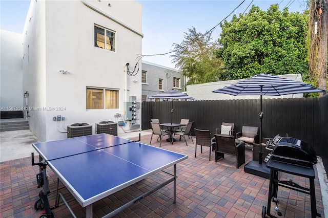 view of patio featuring a grill and central AC unit